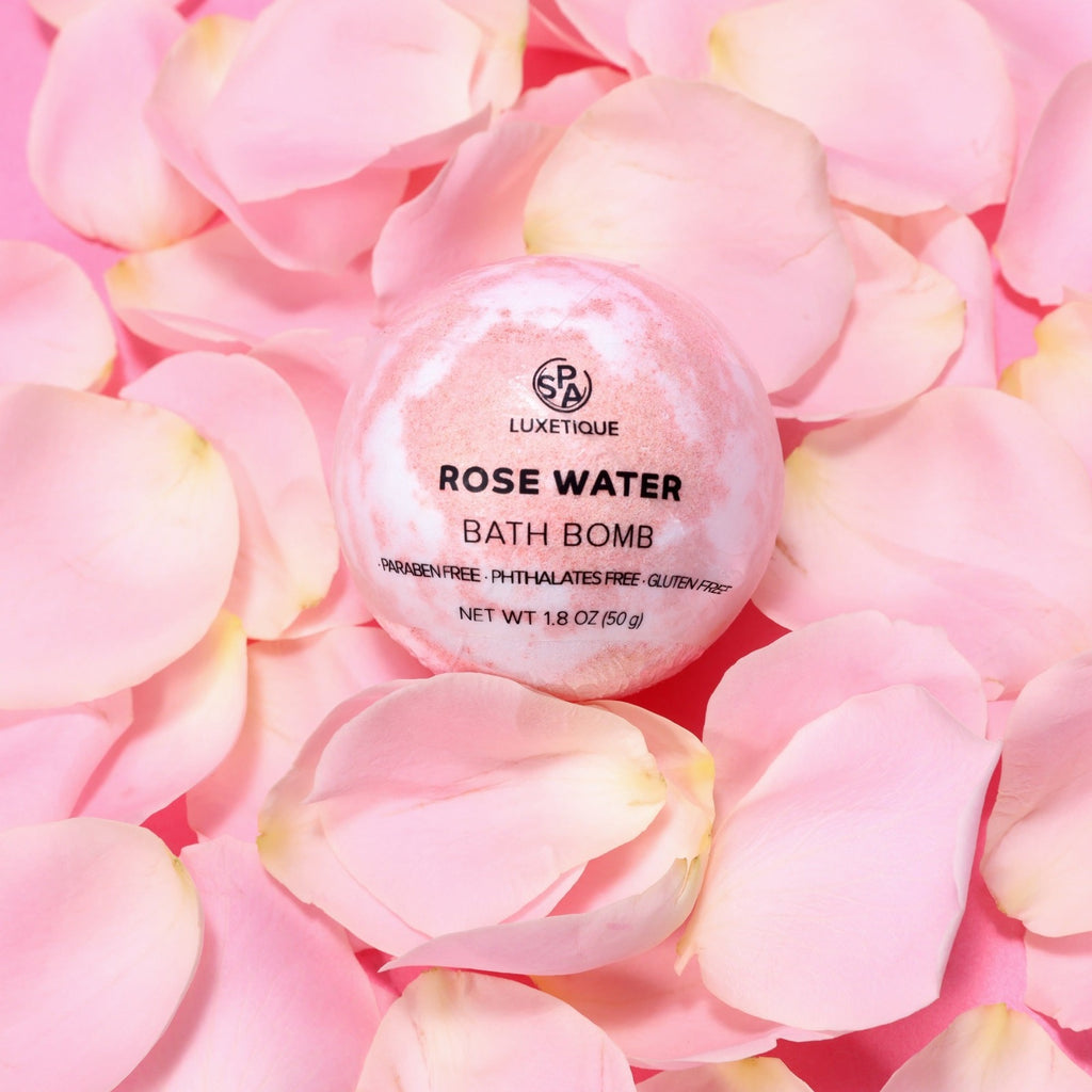 12pcs Gifts Rose Water Gift Set. Transform your bath into a luxurious spa experience with our Rose Oil Bath Bomb. Infused with moisturizing Coconut Oil, Vitamin E, and Shea Butter, this bath bomb will leave your skin hydrated, soft, and glowing. Soothing Rose Oil will provide a calming aroma and enhance your skin's natural radiance. Indulge in ultimate relaxation and rejuvenation at home with our Rose Oil Bath Bomb.